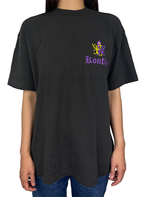 Person wearing a black t-shirt with a logo and text on a white background